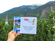 Eurohike travel documents Lake Reschen - Lake Kaltern, apple orchards and mountains in the background