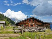 Alpine hut with mountain panorama