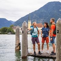 Three hikers enjoy the peace and quiet by the lake