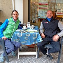 Two people drink a coffee together in Bolzano