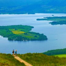Hikers at the crystal clear Loch Lomond