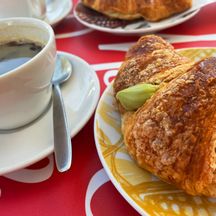 Coffee break with pistachio croissant