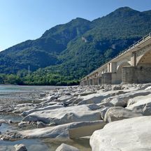 Bank of the Tagliamento with mountains in the background