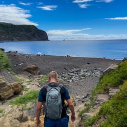 Hiker on the beach in the Azores