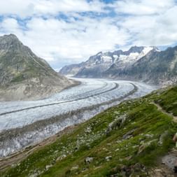 Woman hiking directly on the Aletsch Glacier