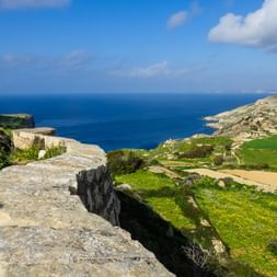 Stone wall with sea view in Malta