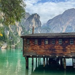 Fishing hut on Lake Braies with the mountains in the background