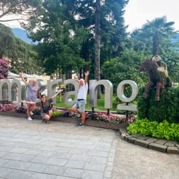 Hiking group in front of Merano landmark