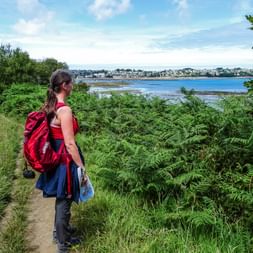 Hiker on the path with coastal view