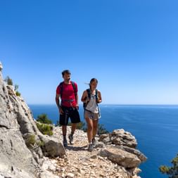 Hiking couple at Cala Mariolu