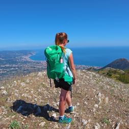 Hiker with a view of the Ligurian Sea