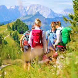 Hiking group with hiking backpack in Salzkammergut