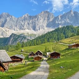 Almhuetten in Ramsau in front of a mountain panorama
