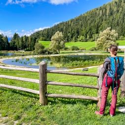 Hiker in front of a pond