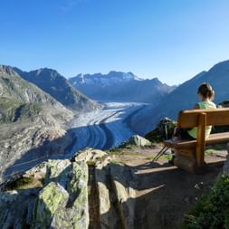 Woman on a bench on the Aletsch Glacier