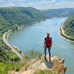 Hiker enjoys the view from Spitsnack on the Rheinsteig