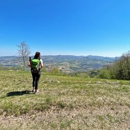Hiker with a view of Langhe