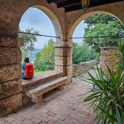 Hiker enjoys the view in Porana eremo di san rochetto