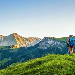 Hiker enjoys the view from Reichenau in the Kandertal Hiker enjoys the view from Reichenau in the Kandertal