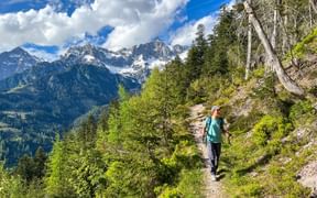 Hiker with mountain panorama in the background