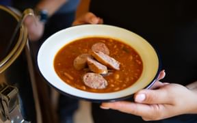 Plate of bean stew with Krainer sausage