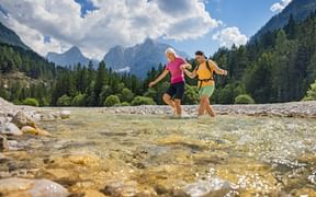 Hikers at Lake Jasna in Slovenia