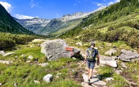 Hiker in the core zone of the national park, in the Krimml Achental valley