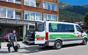 Employee brings luggage to the Eurohike bus