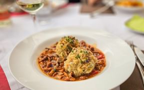 Bread dumplings with chanterelles