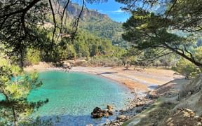 Cala Tuent is a cove with a rocky beach near the Tramuntana mountains