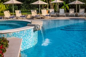 Pool area with deck chairs