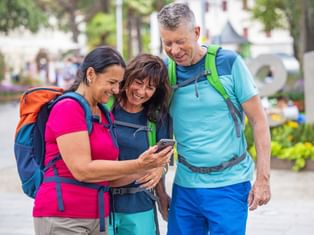 Hikers using the Eurofun app on the Passer promenade in Merano