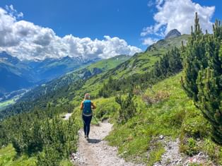 Hiker with a beautiful mountain panorama from Steeg to Landeck
