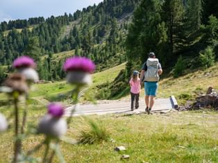 Hiking family on the Haideralm in South Tyrol