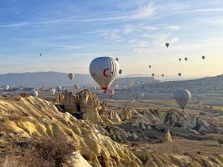 Hot air balloons in Cappadocia with a view of the fairy chimneys