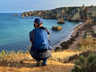Hiker enjoys the view of the Praia da Dona Ana