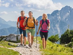 Hiking trio on the Alpe-Adria Trail Hiking trio at the Vršič Pass on the Alpe-Adria Trail in Slovenia