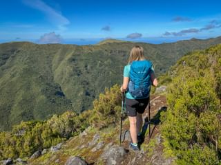 Hiker pauses on a hiking trail in Madeira