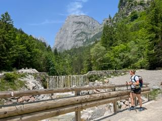 Hiker by the Rio Masso river via Lungolado