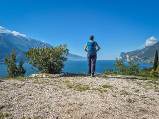 Hiker at Punta Larici on Lake Garda