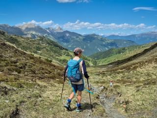 Hiker in the Gschnitztal valley with panoramic view