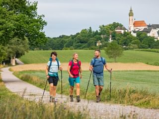 Hikers on a hiking trail near Andechs Monastery