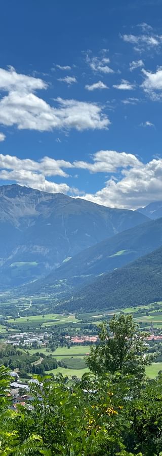 Panoramic view of Mals under a blue sky