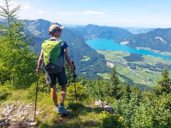 Hiker with a panoramic view of Lake Wolfgangsee