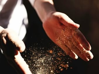 Hands with flour while baking bread