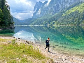Hiker on the shore of the Gosausee