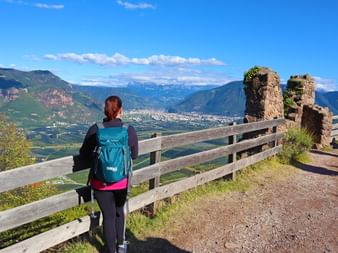 Hiker with a panoramic view of Bolzano