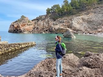 Hiking break in the picturesque bay Cala Deià