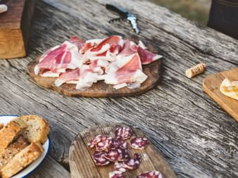 Typical Slovenian snack on a wooden board