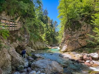 Bridge on the riverbank on the Alpe-Adria Trail